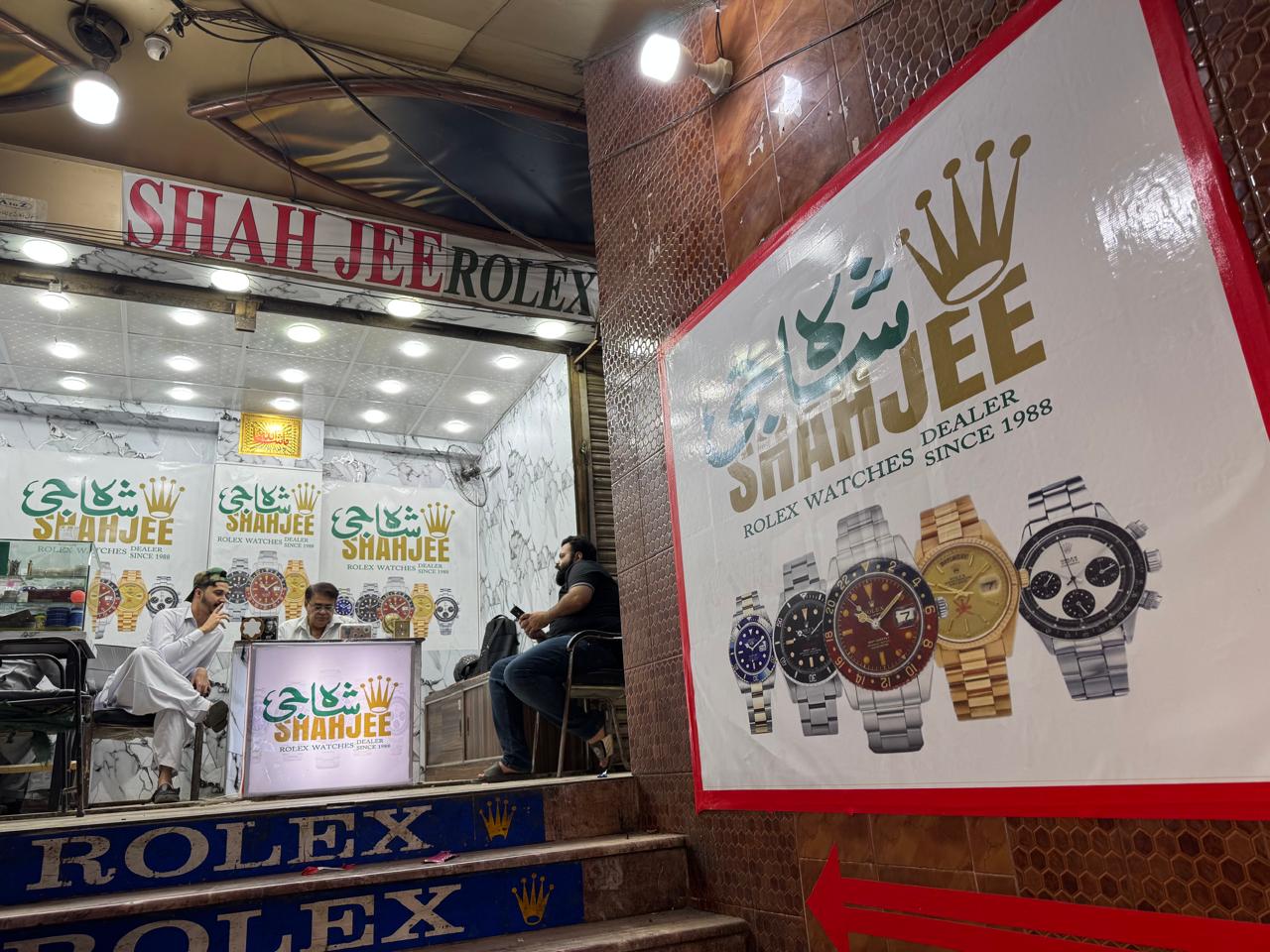 Shahjee Rolex Dealer entrance steps with poster